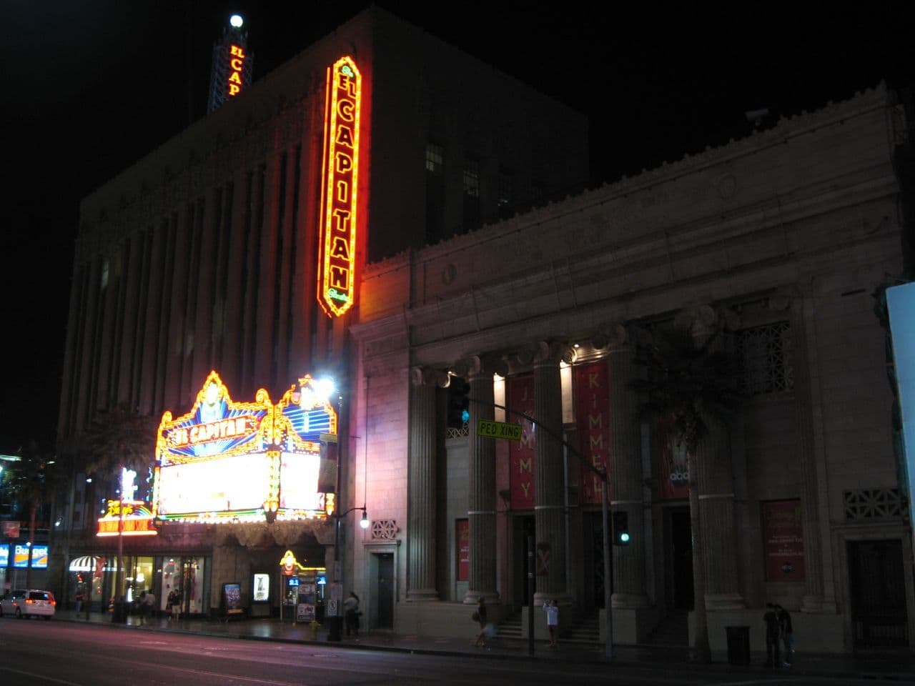 Nighttime view of the El Capitan Theatre in Hollywood, home of Jimmy Kimmel Live!, lit with neon signage