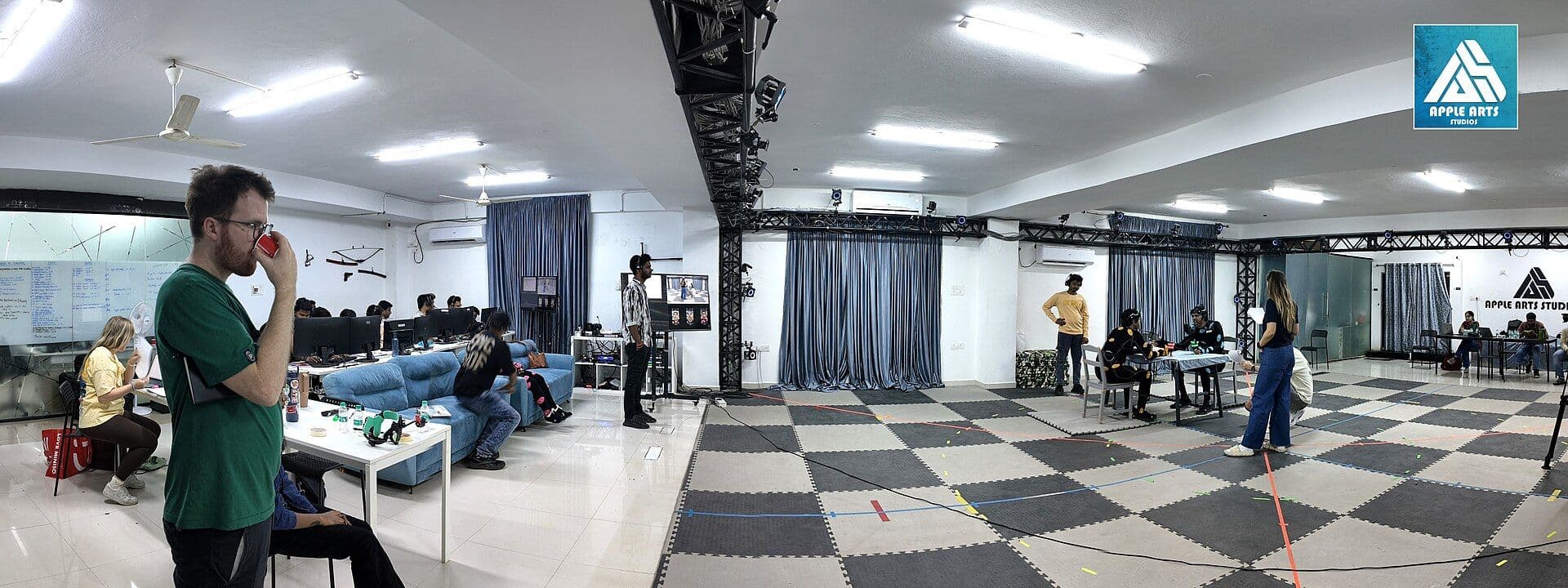 Motion capture stage with crew recording performer movements