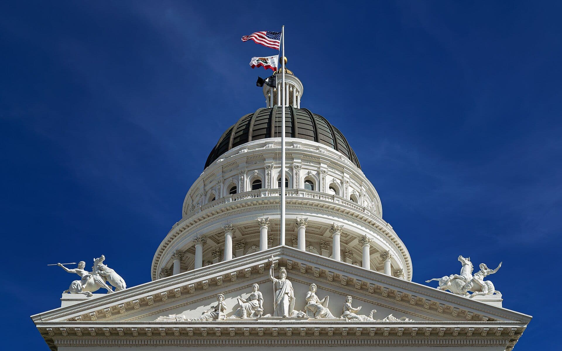 California State Capitol building dome and rotunda against blue sky