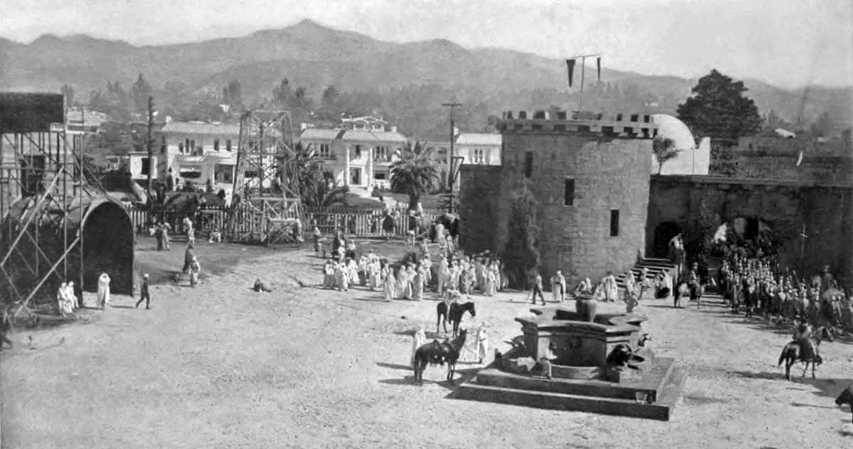 Studio set built on William Fox lot showing reconstructed buildings and crowds