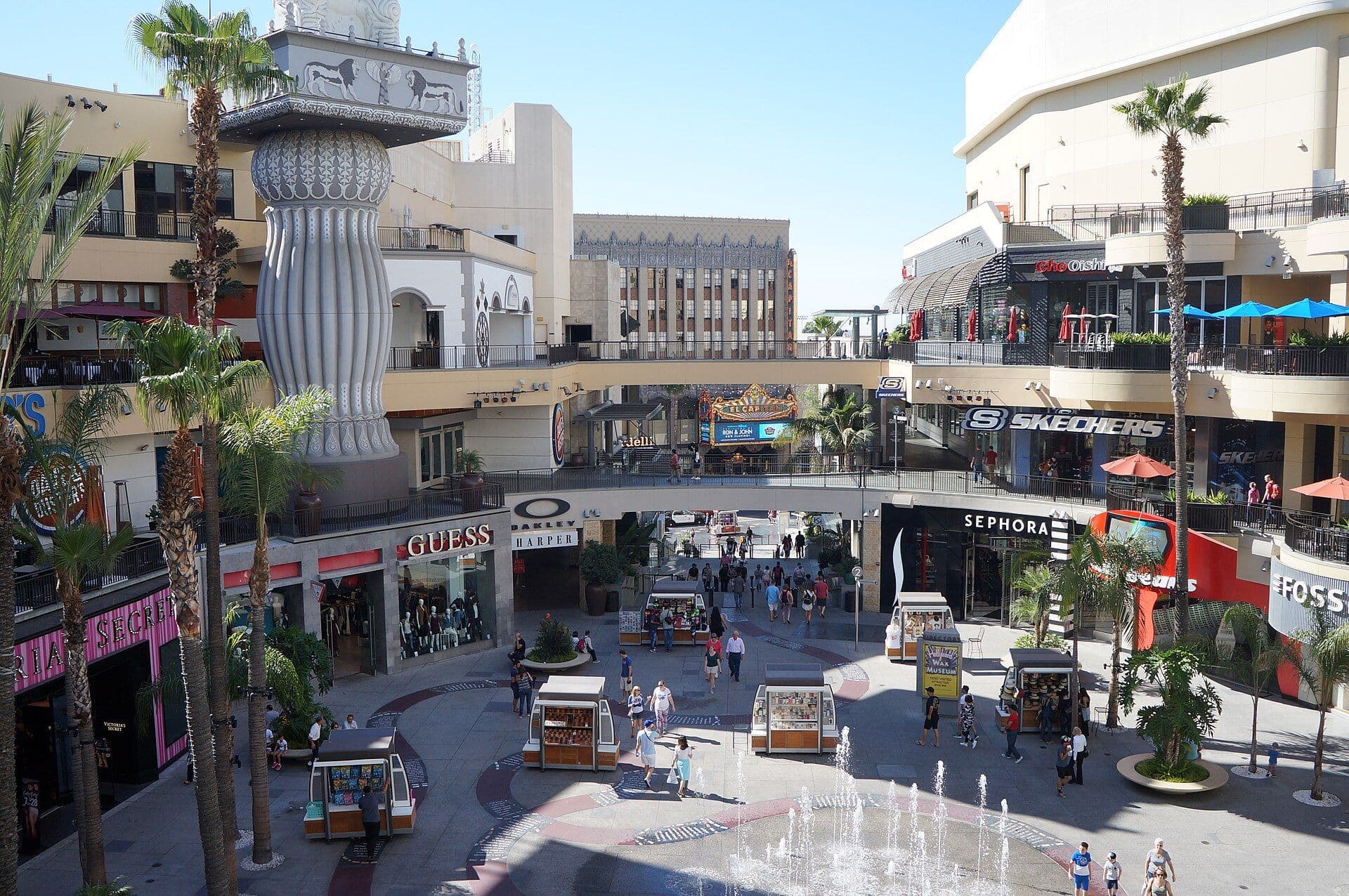 Hollywood Boulevard commercial district with Hollywood sign visible on distant hills