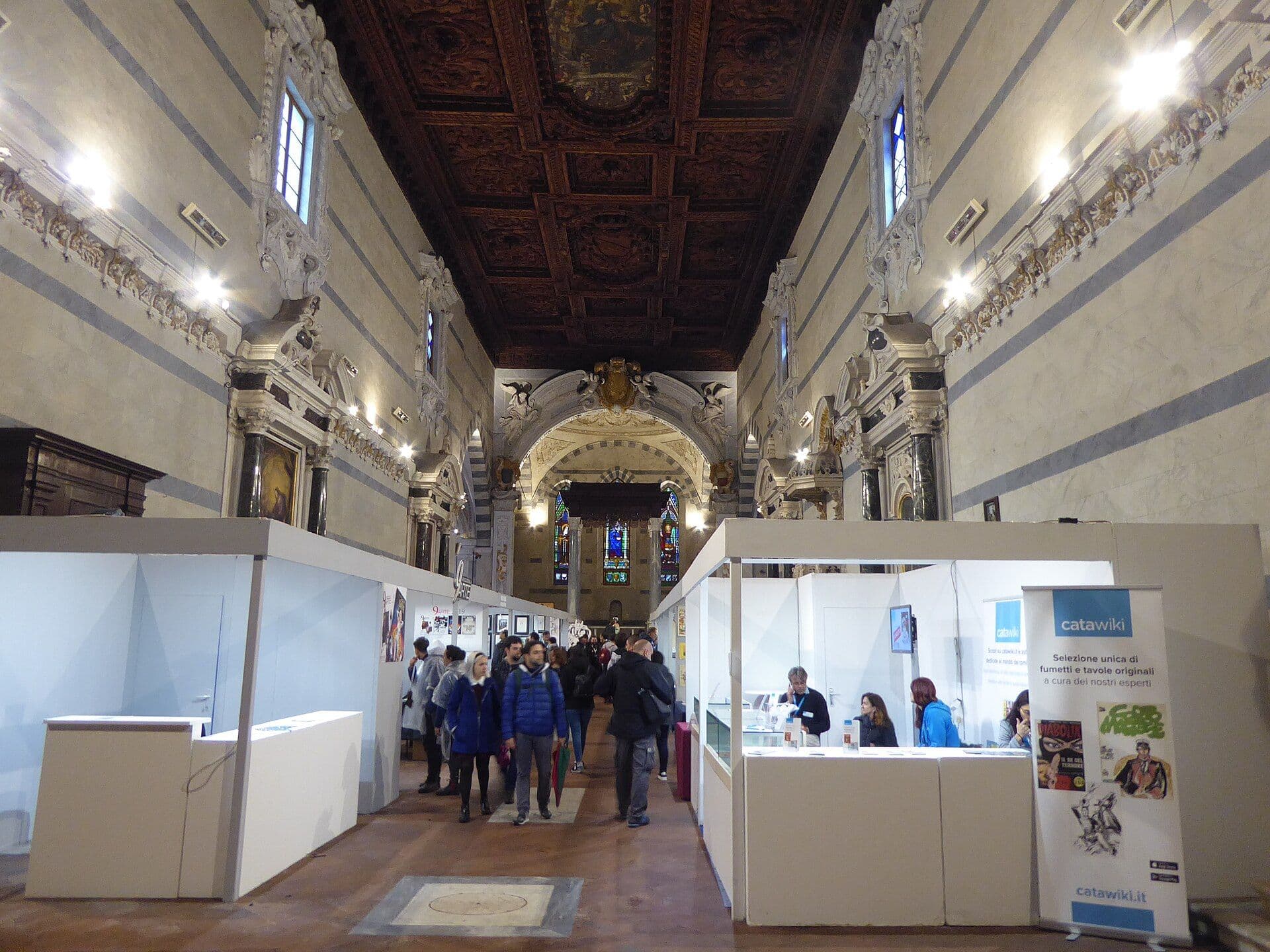 Historic church interior with frescoes and ornate ceilings