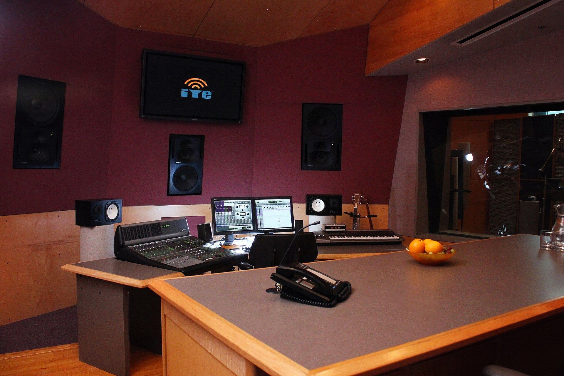 Recording studio mixing room with professional audio equipment and monitors